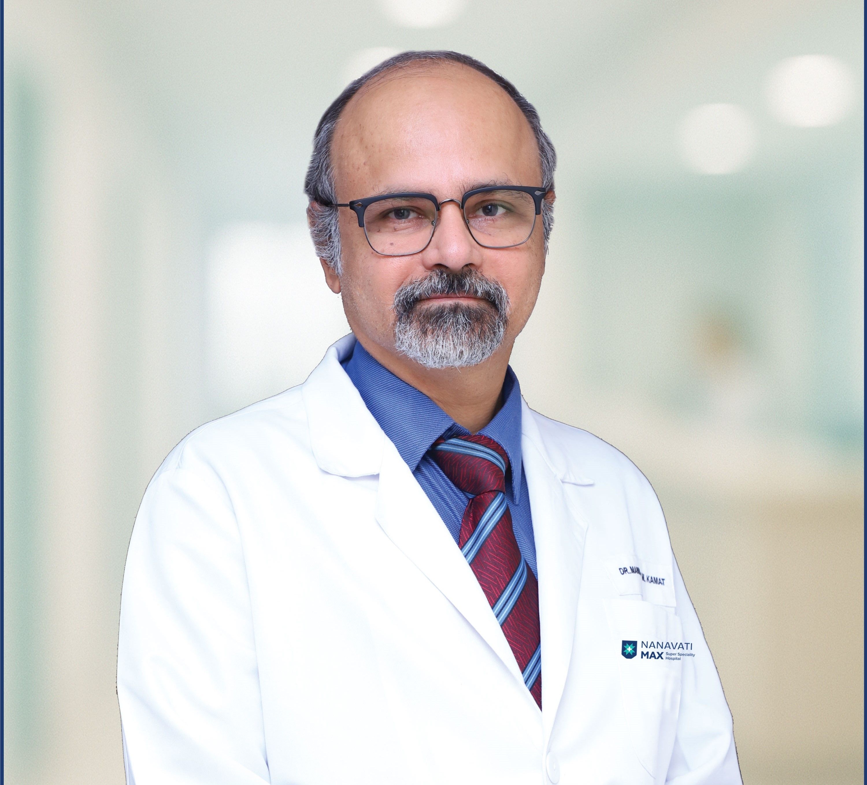 Dr. Manmohan M. Kamat